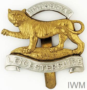 Leicester Regiment cap badge © IWM (INS 5592)