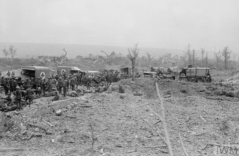 Motor ambulances and horse-drawn ambulance wagons of the RAMC collecting wounded on the Western Front © IWM (Q 3975)