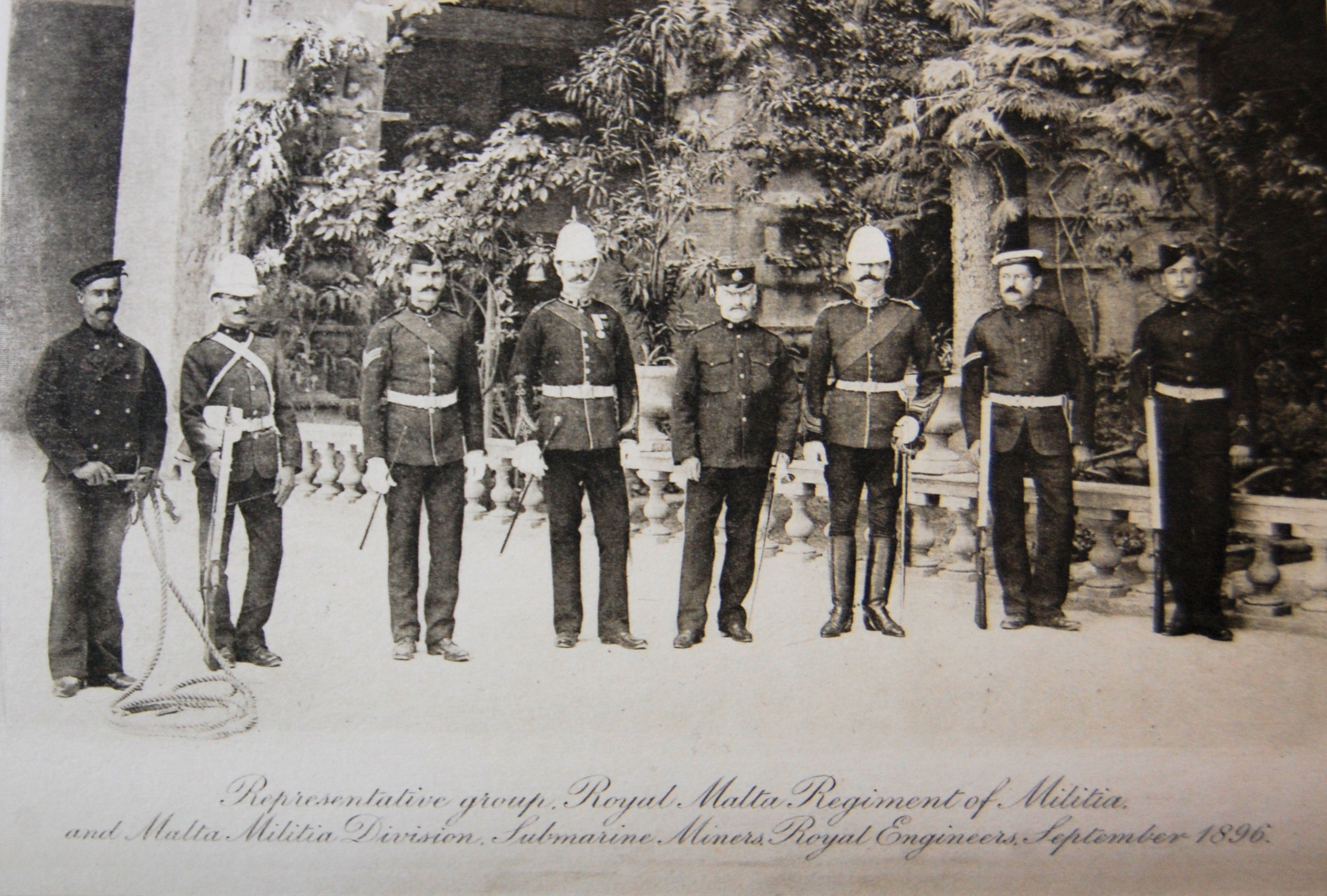 Royal Malta Regiment of Militia Sept 1896 showing Spr P Caruana S M Miners RE (Winter dress) , Pte Ciantar (Marching Order) Sgt Buhagiar (Walking out dress), Sgt Maj W Morrison (Review Order) Lt Col H Vella CO, Maj R P Samut, Cpl G. B. Vella S M Miners RE (Summer Dress), LCpl Brockdorff RMRM Cadet Coy (Drill Order) (from Chesney A. G.). 
