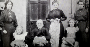 Charles's mother (standing centre)