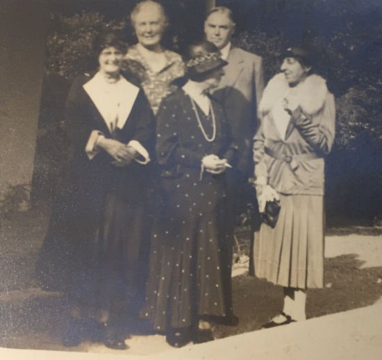 Elizabeth Holgate Harris (on right) in front of the Woodlands, others identification unconfirmed
